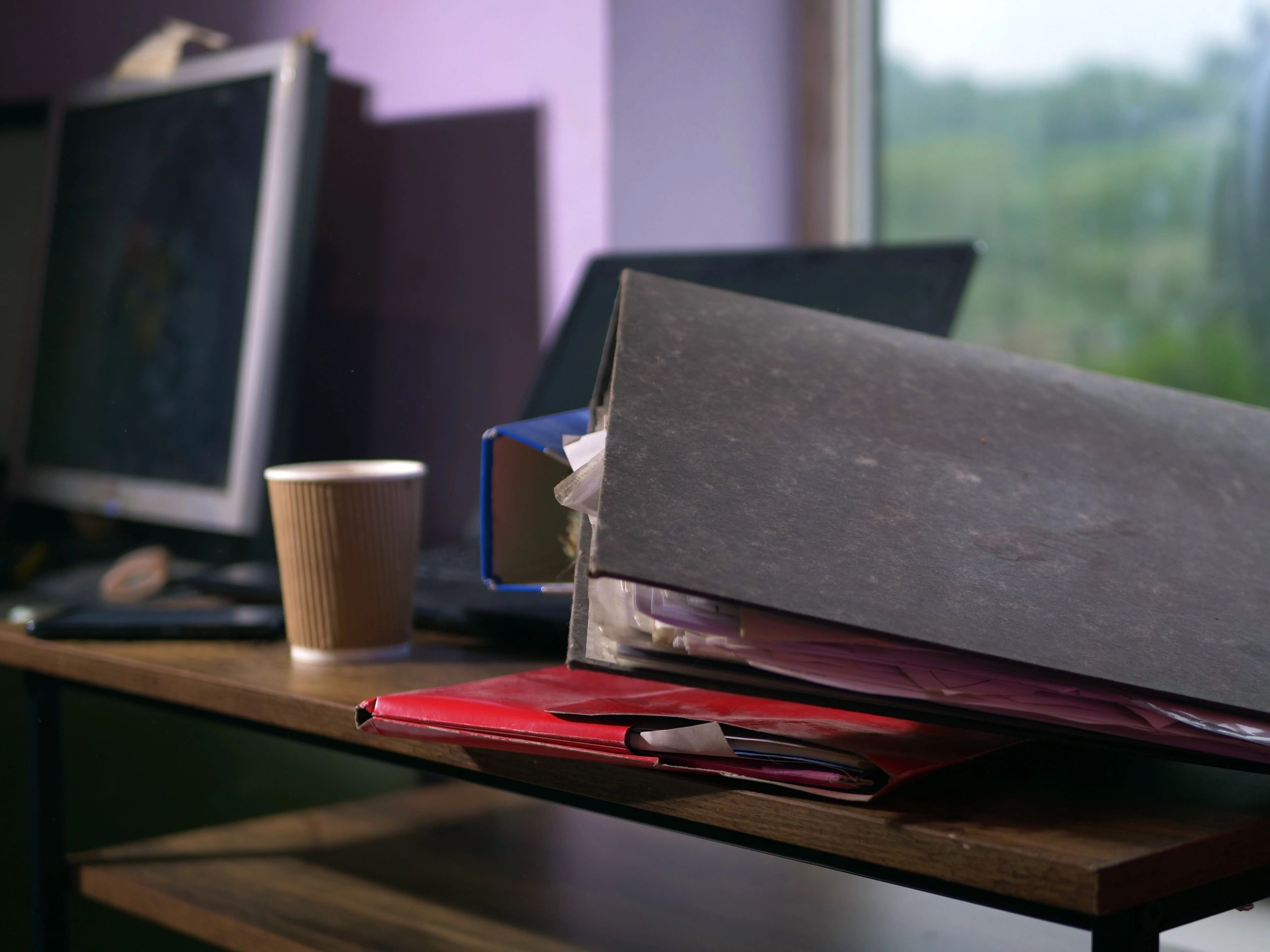 Desk with folders and files representing organised archival family history research